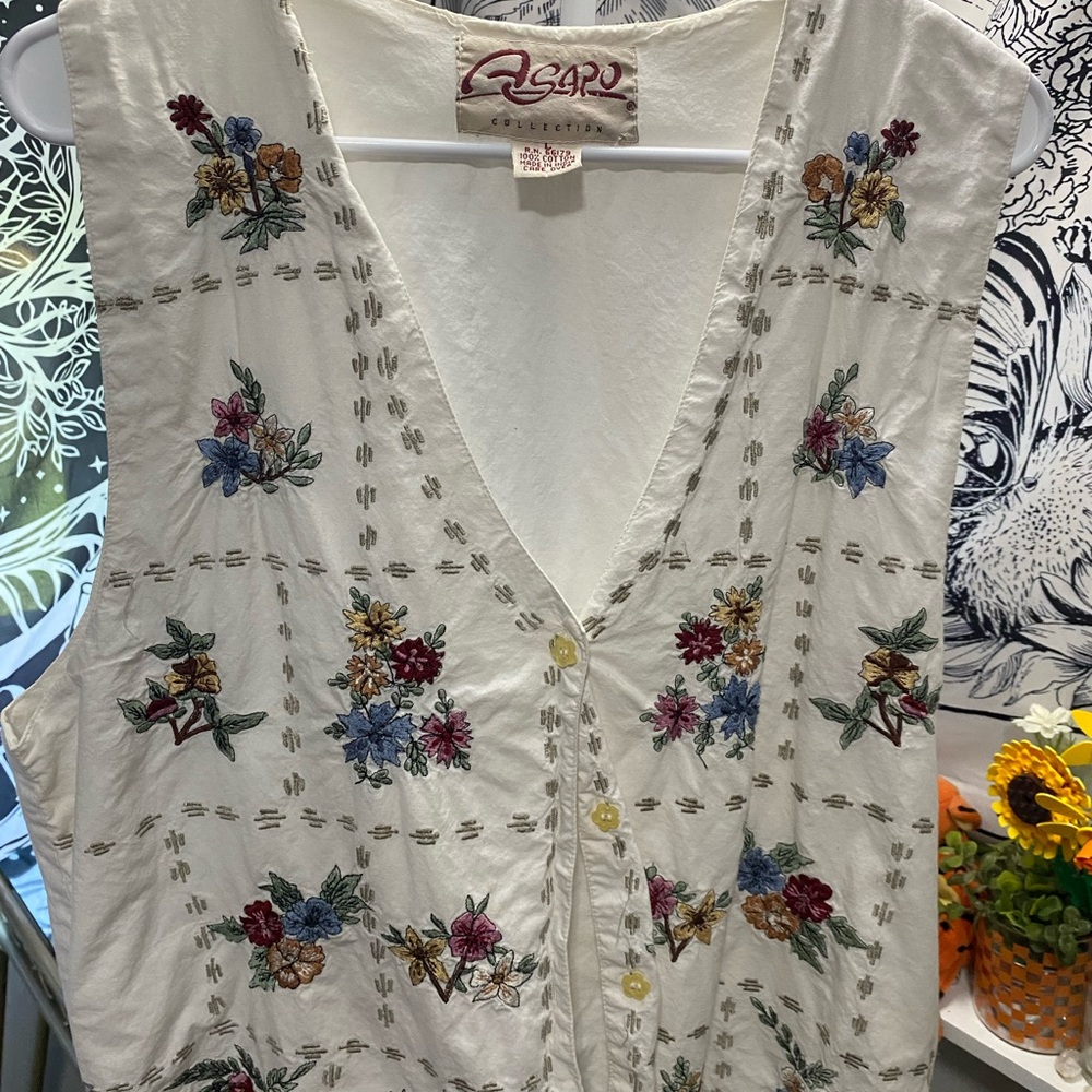 White Sleeveless Embellished Blouse with Buttoned Front